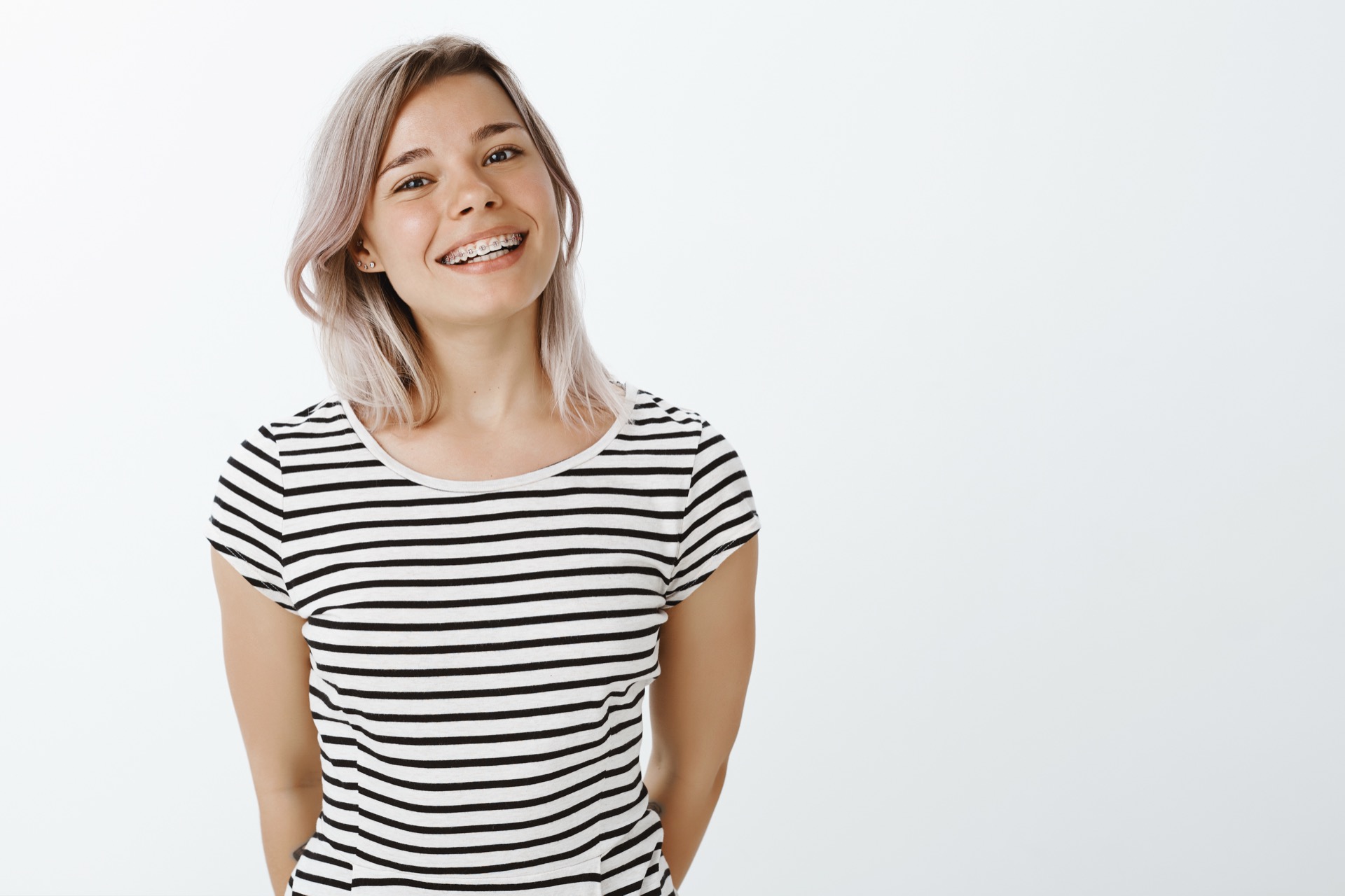 Smiling patient with braces at Ketcherside Orthodontics in Corona, CA